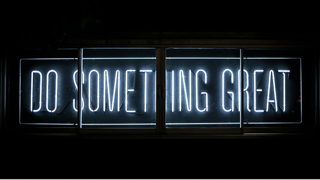 Neon sign reading "Do Something Great"